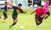 Tavita Talaga, (left) of Nu’uuli Voc-Tech in action against the Leone Lions in an ASHSAA Boys’ varsity soccer game on Monday, March 26, 2018 at Pago Park Soccer Stadium.  [FFAS MEDIA/Brian Vitolio]