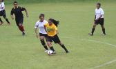 Oloataua Tofaeono of the Leone Lions dribbles the ball while being defended by the Fa’asao-Marist Cougars’ Jordynn Liu-Kuey during an ASHSAA varsity girls’ soccer game on Saturday, Feb. 24, 2018 at Pago Park Soccer Stadium.  [FFAS MEDIA/Brian Vitolio]