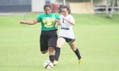  Michelle Wisneske (#7) of South Pacific Academy, and Leone Lions’ Frances Nautu (#3) battle for possession of the ball during an ASHSAA Girls varsity soccer game on Monday, Feb. 6, 2017 at Pago Park Soccer Stadium.   [FFAS MEDIA/Brian Vitolio]