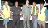 Texan aviator and pilot Brian Lloyd (middle) on the tarmac at the Pago Pago International Airport, with people who serviced his plane last Saturday night, upon arrival for a stopover in American Samoa, around 9 p.m. Lloyd is on an around-the-world solo flight to commemorate American female aviator, Amelia Earhart’s famous flight 80-years ago. Pictured with him (L-R) Jason Pritchard of Pritchard’s Airport Service — a local airport ground handling company — an airport police officer, and the PAS crew. [photo: