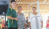 Ne’emia Kaleopa, left, of Utulei Youth receives his 2017 FFAS Futsal Tournament MVP award from FFAS executive member Amio Mavaega-Luvu (middle) and FFAS Vice- President and FIFA Council member Sandra Fruean (right), on Monday, May 29 at the Samoana High School gymnasium in Utulei.  [FFAS MEDIA/Brian Vitolio] 
