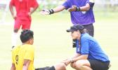 ATC Florence Wasko tending to an injured Paul Collins from the Pago Youth team during an injury time-out early in the opening half of their match up against Veitongo FC last Saturday afternoon. Pago Youth tied the team from Tonga 1 - 1. [photo: TG]