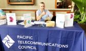 Tim Bailey of Speedcast, Wan Chai, Hong Kong, China manned the Pacific Telecommunications Council booth, at the Hilton Hawaiian Village, Honolulu, Hawaii to help promote cooperation amongst technology firms.    [photo: Barry Markowitz]