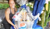 Sales Manager Christa Satele of Pago Pago Trading Company who donated a prize in celebration of the one year anniversary for the Pacific Tires & Auto Parts last Saturday in Tafuna. [Photo: Ese Malala]
