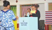 A voter puts a ballot into the ballot box at the Pago Pago village polling station on Election Day. [photo: AF]