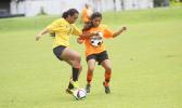 Lei Amisone, left, of Pago Youth defends against PanSa’s striker Maricar Parungo during a game of the women’s 2017 FFAS National League on Saturday, Sept. 23 at Pago Park Soccer Stadium.   [FFAS MEDIA/Brian Vitolio]