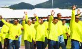 Paramount Builders Inc., workforce marches Friday during the ASG Workforce Day ceremony at Veterans Memorial Stadium in Tafuna. [photo: AF]