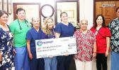 As has been the norm in past years, Paramount Builders donated $12,000 yesterday to the LBJ Medical Center, to help with costs associated with having a team of cardiologists and specialists from the Oregon Health and Science University in the territory this week to treat local youngsters with possible cases of rheumatic fever and those already diagnosed with rheumatic heart disease. Mrs. Wanda Alofa, wife of Paramount Builders owner/ CEO, presented the check to LBJ Chief Executive Officer Faumuina Taufetee 