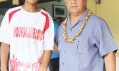Pauli Afu, left, of Vaiala Tongan’s 13-15 boys receives his MVP award for the 2017 FFAS Summer Youth League from Sen. Faiivae Iuli Alex Godinet on July 15 at Pago Park Soccer Stadium. [FFAS MEDIA/Brian Vitolio] 