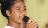 A Pava’ia’i elementary student presenter explains her schools theme and session to the judges during the ASDOE/FFAS Just Play Program finale on Thursday, April 27, 2017 at the DYWA gymnasium in Pago Pago.   [FFAS MEDIA/Brian Vitolio]