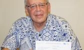 Territorial Bank of American Samoa president Philip Ware shares with reporters from local media the “Official Notice of Routing Number Assignment” issued to TBAS by the American Bankers Association, during an interview Wednesday. Ware plans to put the notice in a picture frame and display it in the bank’s lobby for all to see.  [photo: FS]