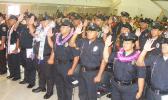 A look at some of the officers as the take the oath of office, as sworn in officers, during Friday’s 25th Police Academy graduation ceremony at Gov. Rex Lee Auditorium. [photo: Fili Sagapolutele]