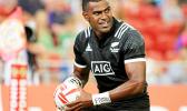 NZ Joe Ravouvou plays with a Wales defender as he scores a try in the All Blacks 36-14 victory over Wales at the Singapore Sevens, Day 1, National Stadium, Singapore.  [Photo: Barry Markowitz]