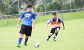 Samoana’s Joseph Choi Jr. looks to cross the ball as a Kanana Fou opponent looks on during their ASHSAA Boys’ varsity soccer playoff game on April 29, 2017 at Pago Park Soccer Stadium. The Sharks won 1-0.  [FFAS MEDIA/Brian Vitolio]