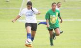 A Samoana Sharks varsity defender clears the ball against a Leone Lions attacker during an ASHSAA Girls Soccer game on Saturday, Jan. 21, 2017 at Pago Park Soccer Stadium in Pago Pago.  [FFAS MEDIA/Brian Vitolio]