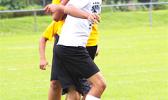 A Samoana Sharks player heads the ball forward while being contested in the air by a Tafuna Warriors’ opponent during an ASHSAA Boys’ JV soccer game on Tuesday, March 27, 2018 at Pago Park Soccer Stadium.  [FFAS MEDIA/Brian Vitolio]