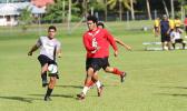 A Dolphins defender clears the ball away from danger before a Faga’itua opponent can get to it during their ASHSAA Boys’ varsity soccer playoff game on April 29, 2017 at Pago Park Soccer Stadium. SPA won 3-2.  [FFAS MEDIA/Brian Vitolio]