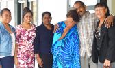 Salend Singh (second from right) with his family including his wife and daughter outside of High Court after the jury found him not guilty to all four charges against him. [photo by AF]