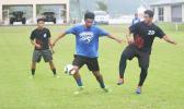 Ueli Tualaulelei, left, tries to control the ball while being defended by Iakina’s Kato Lasalo during their ASHSAA Boys semifinal game on Tuesday at Pago Park Soccer Stadium.   [FFAS MEDIA/Brian Vitolio]