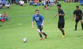 Samoana Sharks’ varsity player Gabriel Taumua dribbles away from a Iakina player during their ASHSAA Boys semifinal game on Tuesday at Pago Park Soccer Stadium.   [FFAS MEDIA/Brian Vitolio]