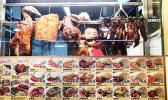 A cook arranges his roast pork, duck and chicken offerings at the Food Loft, Woodlands, Singapore. [photo: Barry Markowitz, 5/1/18]
