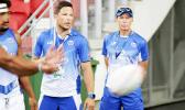 Sir Gordon Tiejtens and his acting trainer son put Manu Samoa through pregame warm ups at the Singapore Sevens, Day 1, National Stadium, Singapore. [Photo: Barry Markowitz]
