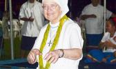 Sister Sheila, who traveled from Britain to join the rest of American Samoa to celebrate the 30th Anniversary of Hope House, got to dance on the grounds she walked and served once before, Fatuoaiga, Heart of Families. She was instrumental in the opening of Hope House in 1987.  [photo: Leua Aiono Frost]