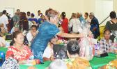 ducation Department deputy director Faauifono Vaitautolu, giving out gift baskets to senior citizens at yesterday’s Senior Citizens Christmas Program 2016, held at the Pago Pago Youth Center. The event is an annual celebration hosted by the Lolo Administration.   [photo: AF]