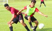 A Tafuna Warriors’ player and Faga’itua Vikings’ opponent, in action during an ASHSAA Boys’ varsity soccer game Friday, April 6, 2018 at Pago Park Soccer Stadium.  [FFAS MEDIA/Brian Vitolio]