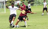 A Crusaders player (left), and Warriors opponent battle for control of the ball during their ASHSAA Boys’ varsity soccer playoff game on Saturday, April 29, 2017 at Pago Park Soccer Stadium.  [FFAS MEDIA/Brian Vitolio]