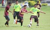 A Tafuna player tries to dribble past a Leone defender during their ASHSAA Boys’ J-V soccer playoff game on April 29, 2017 at Pago Park Soccer Stadium. Tafuna won 1-0.  [FFAS MEDIA/Brian Vitolio]