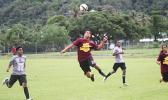 A Tafuna Warriors’ player heads the ball away from SPA’s Peter Reid during their ASHSAA Boys semifinal game this past Tuesday at Pago Park Soccer Stadium.  [FFAS MEDIA/Brian Vitolio]