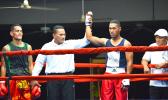 American Samoa raising star, George Tanoa Jr (right) raising his hand after a knockout win over his tough opponent, Tasi Tonelafo (left) of Tumua ma Pule boxing club in the middleweight division during the American Samoa Flag Day 2018 Championship Boxing between the two Samoas last Saturday night at the old Bowling Alley in Tafuna.  [photo by AF]