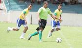 A Lion Heart player dribbles away from Vaiala Tongan opponents on in a men’s game on Match Day 12 of the ongoing, 2016 FFAS National League on Saturday, Nov. 12, at Pago Park Soccer Stadium.  [FFAS MEDIA/Brian Vitolio]