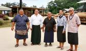 This undated photo provided by ASG Commerce Department, shows DOC director Keniseli Lafaele (far right), next to him is Paul Young, ASPA’s Managing Director and the Governor’s Tongan Liaison Officer, Sione Lousiale Lotolua Kava (far left) and officials of the Tonga Forestry and Milling Company in Tonga. In the background (on the right side) are electricity poles manufactured by the Tonga Forestry and Milling Company.  [photo: provided by DOC]
