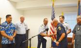 Falana’ipupu Taase Sagapolutele shaking hands with U.S Coast Guard Sector Commander from Honolulu, Capt. Michael C. Long after the DPS Deputy Commissioner received his Certificate of Recognition last week. See story for details.  [photo: AF] 