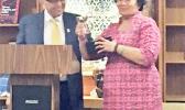 Dr. Underwood presents Congresswoman Amata with the 2017 Distinguished Alumnus Award. [courtesy photo]