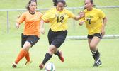 Two Pago Youth defenders (right) in action against an Utulei Youth during a women’s game on Match Day 5 of the 2016 FFAS National League on Saturday, Sept. 17, at Pago Park Soccer Stadium.  [FFAS MEDIA/Brian Vitolio] 