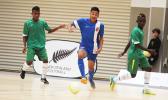 Walter Pati of American Samoa dribbles away from two Solomon Islands’ opponents during a game of the OFC Youth Futsal Tournament at Bruce Pulman Arena in Auckland, New Zealand on Wednesday, October 4, 2017.  [FFAS MEDIA/Brian Vitolio]