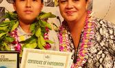 The winner of the 2018 Samoa News Spelling Bee with major sponsor representative — McDonald's American Samoa — Michael Sun of SPA- 1st place, and Carol Tautolo-Samuelu, GM of operations for McDonald's American Samoa. [photo: Leua Aiono Frost]
