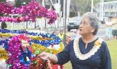First Lady Cynthia Malala Moliga turns on the switch to light the official Christmas Tree of the Territory — at the Fagatogo Pavilion on Sunday, during the first night of the 39th annual Holiday Music Festival hosted by the American Samoa Council on Arts, Culture & Humanities and the Department of Youth and Women’s Affairs. Tonight is the last night of the holiday event. The public is invited to attend. [photo: AF]