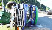 overturned bus in Aua