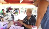 sewing instructor, Diana Tarrant teaching certain methods of sewing to a participant