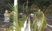 employees from the Department of Administrative Services, Housing Division, were seen at Faganeanea in 2019, decorating the roadside,