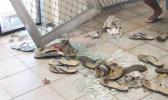 Broken glass and scattered slippers