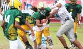 Wylan Faga of the AYFS Packers breaking tackles through midfield and out towards the open field to score his second touchdown of the game in the second quarter of their match up against the AYFS Panthers. Faga led the Packers in their 32 - 6 victory. [photo: TG]