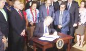  Flanked by Members of Congress and Secretary Shulkin, including Congresswoman Amata,  President Trump signs the Department of Veterans Affairs Accountability and Whistleblower Protection Act into law. [courtesy photo]