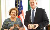 Cong. Aumua Amata with coins and Director David J. Ryder