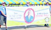 American Samoa Environmental Protection Agency employees with a banner honoring the agency’s executive director Ameko Pato at last Friday’s Workforce Day at Veterans Memorial Stadium. 