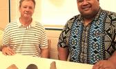 Earl Andersen (left) and Territorial Librarian, Justin Maga pictured yesterday at the Feleti Barstow Public Library where Andersen, on behalf of the Rev. Fred Andersen family, returned to the territory what appear to be stone artifacts 